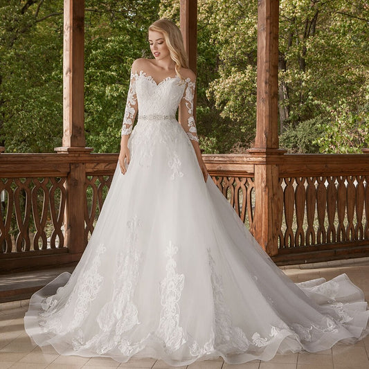 2021 New Illusion O Neck Long Sleeves Tulle A-Line Wedding Dresses Appliqued Beading Crystal Bow Floor Length Bridal Gowns - LiveTrendsX