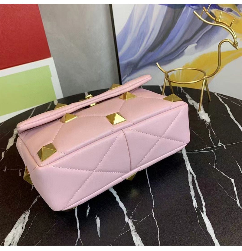leather luxury rivet handbag