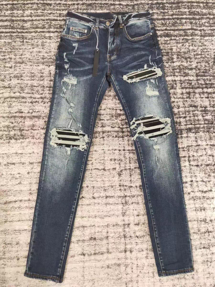 men leather patch distressed indigo jeans