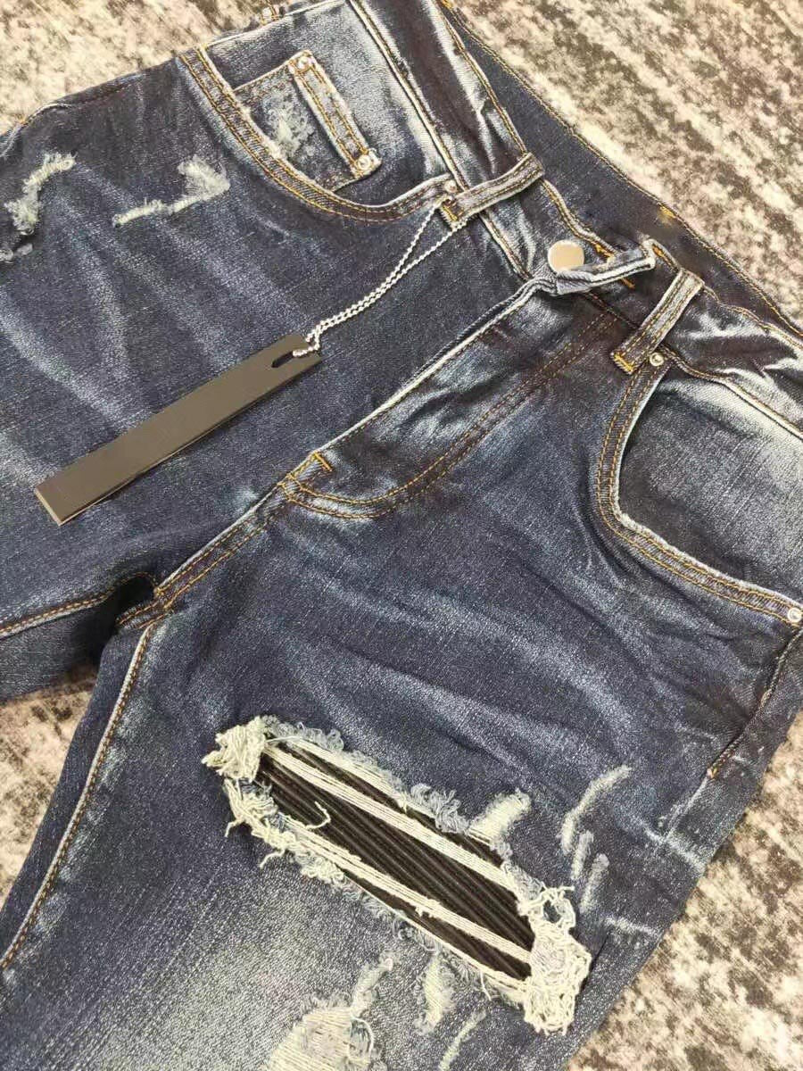 men leather patch distressed indigo jeans