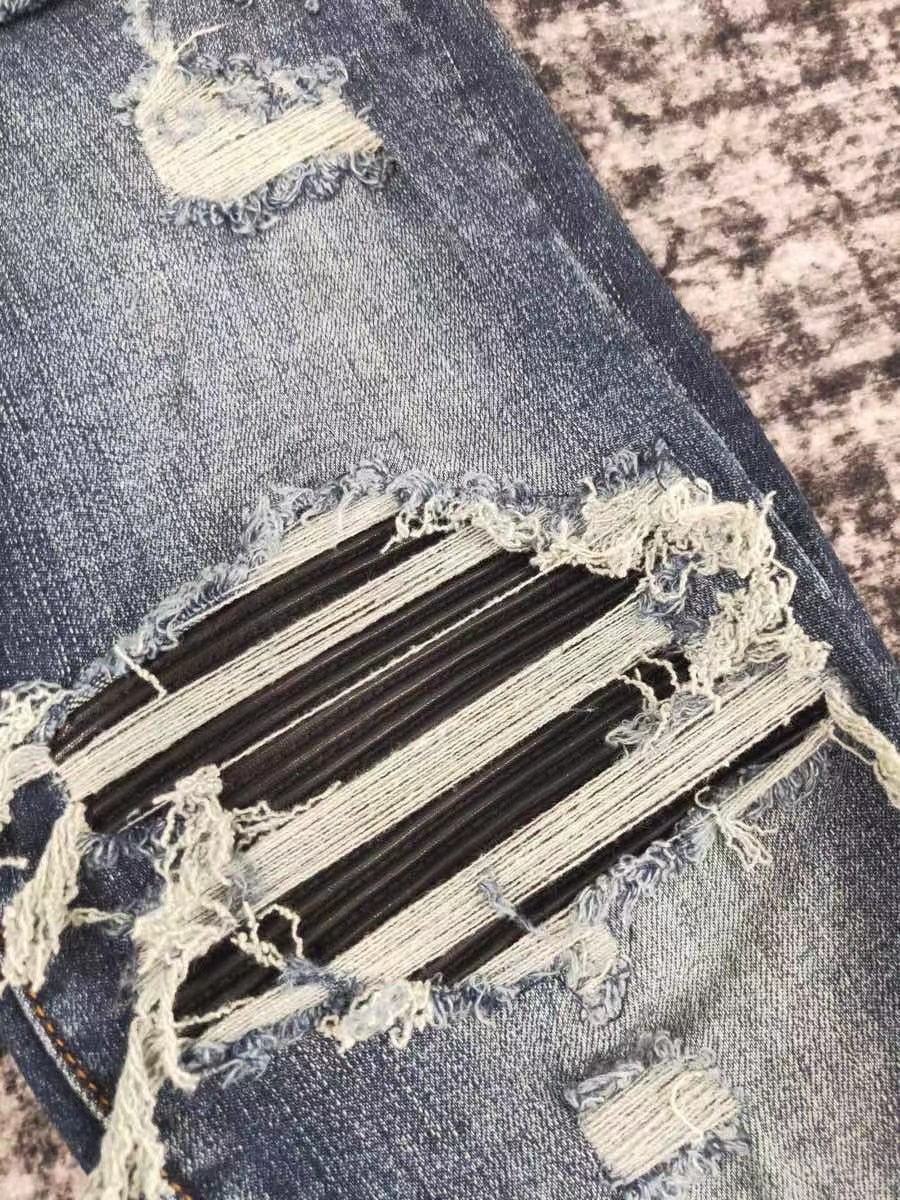 men leather patch distressed indigo jeans