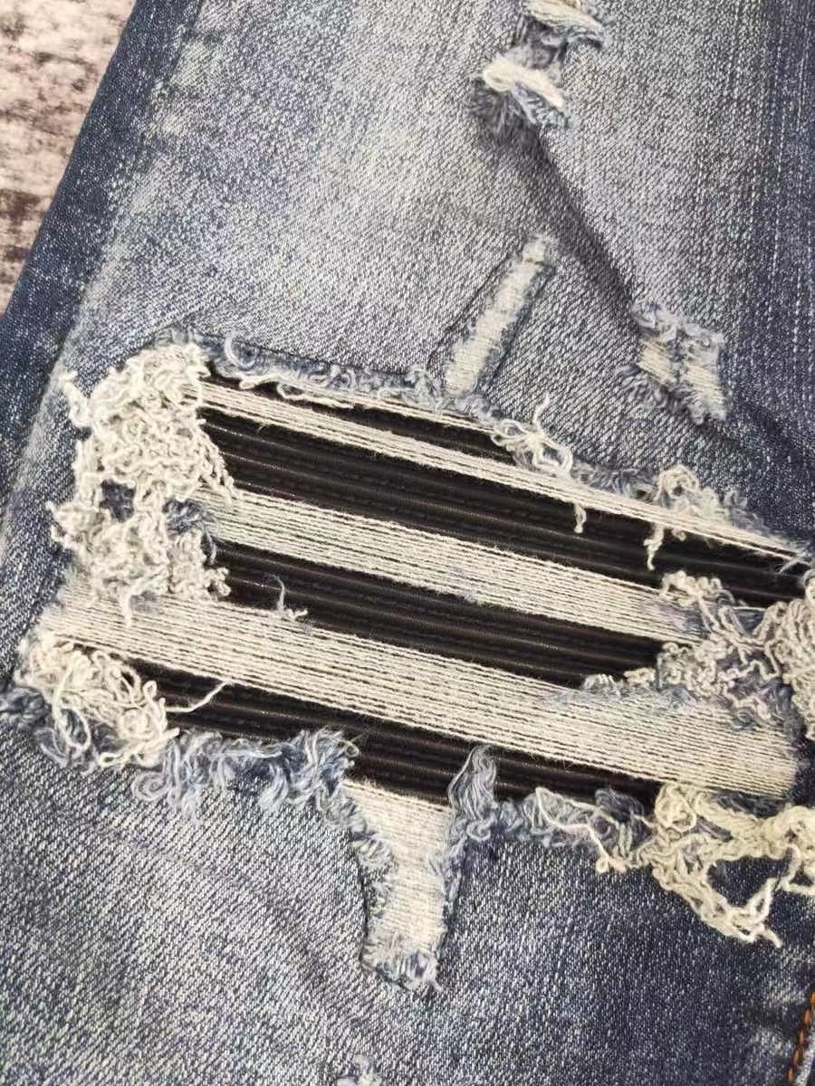 men leather patch distressed indigo jeans