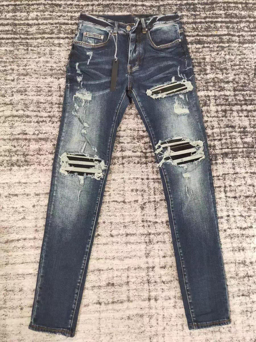 men leather patch distressed indigo jeans